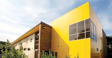 Alger Hall exterior, focused on yellow portion of building